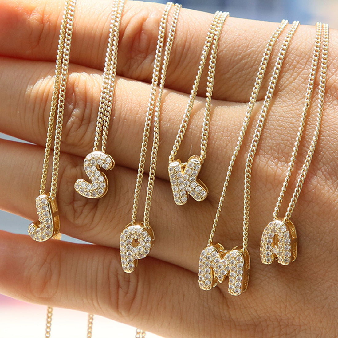 Delicate personalized pendant necklace, editorial styling for the zodiac jewelry guide